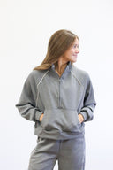Outline Quarter Zip, half zip knit top with piping detail